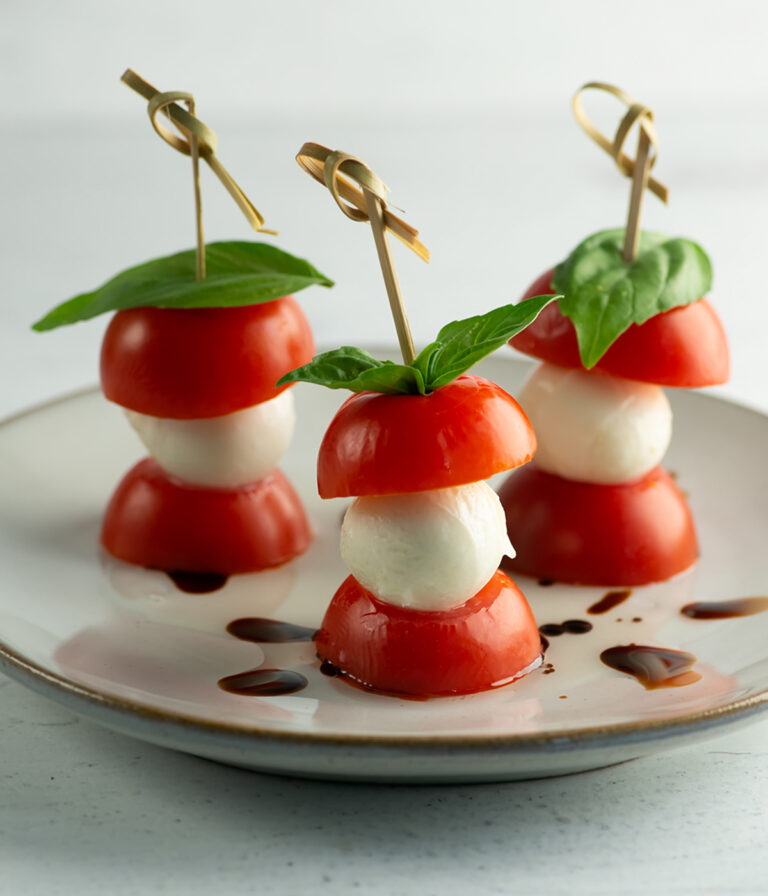 Caprese skewers on a plate ready to serve.