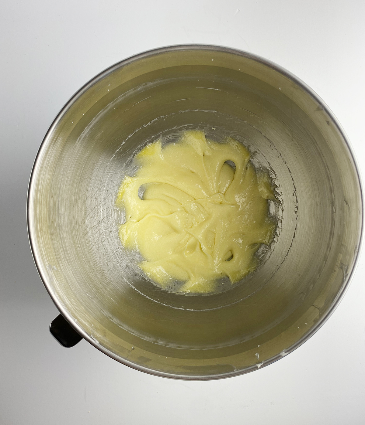 Creamed butter, sugar and egg in a mixing bowl.
