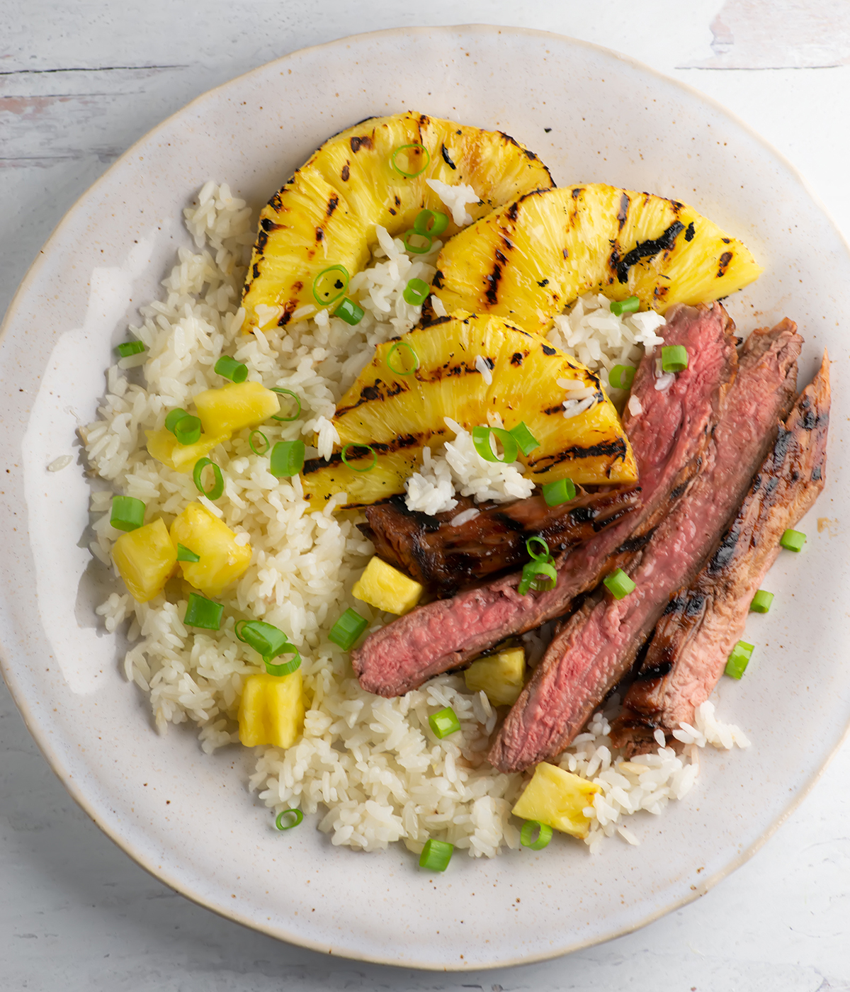 Pineapple Steak with Rice on a plate.