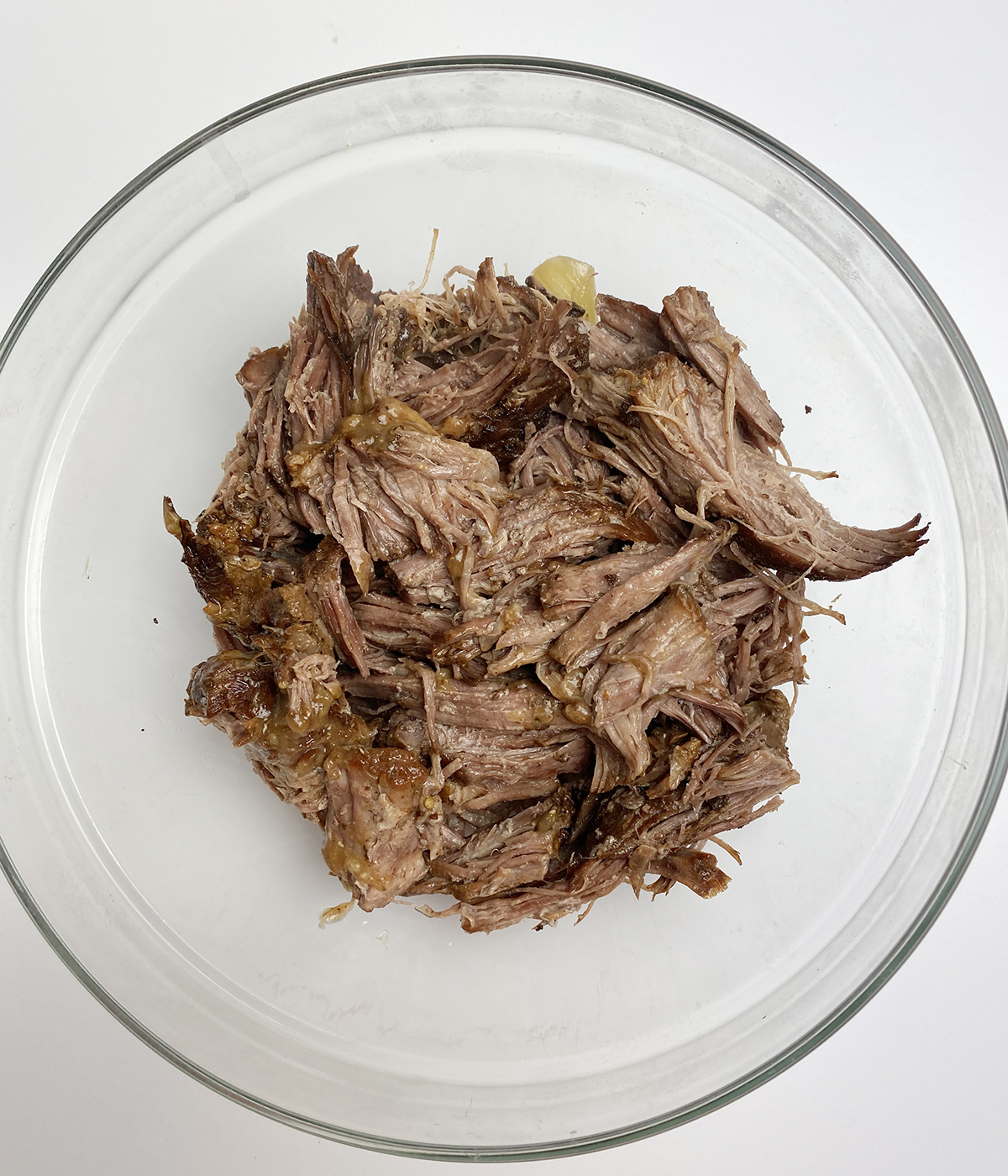 Shredded pot roast in a bowl.