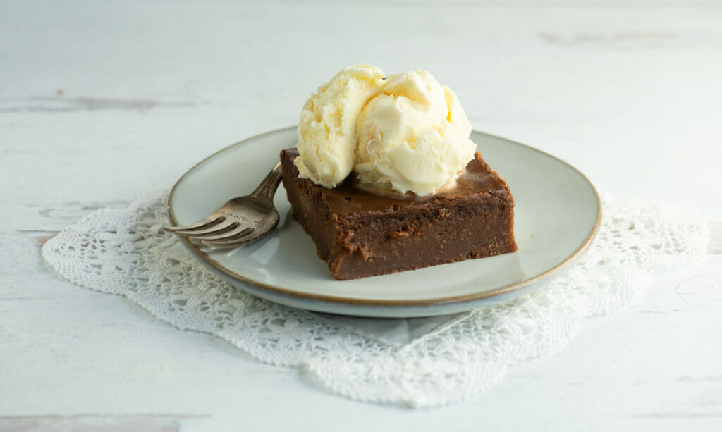 Slice of southern coca-cola cake with ice cream