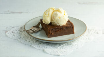 Slice of southern coca-cola cake with ice cream