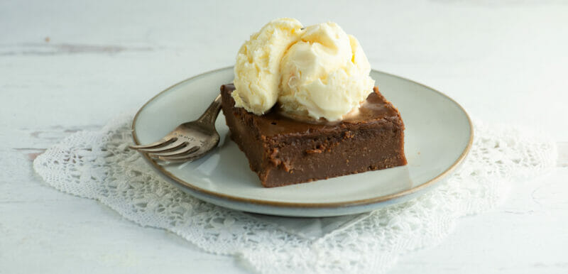 Slice of southern coca-cola cake with ice cream