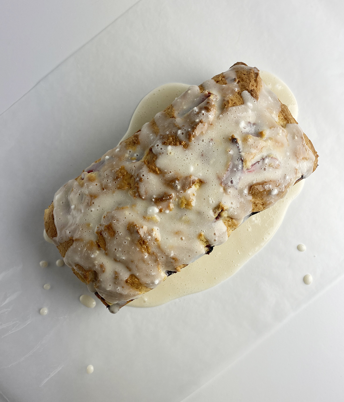Strawberry bread with glaze poured on top.