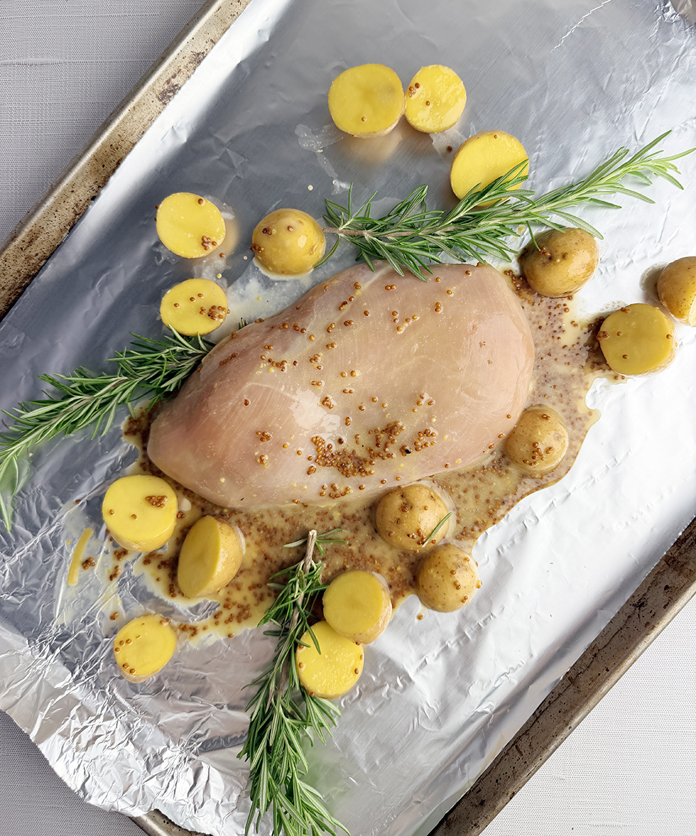 Chicken and baby potatoes ready for the oven.