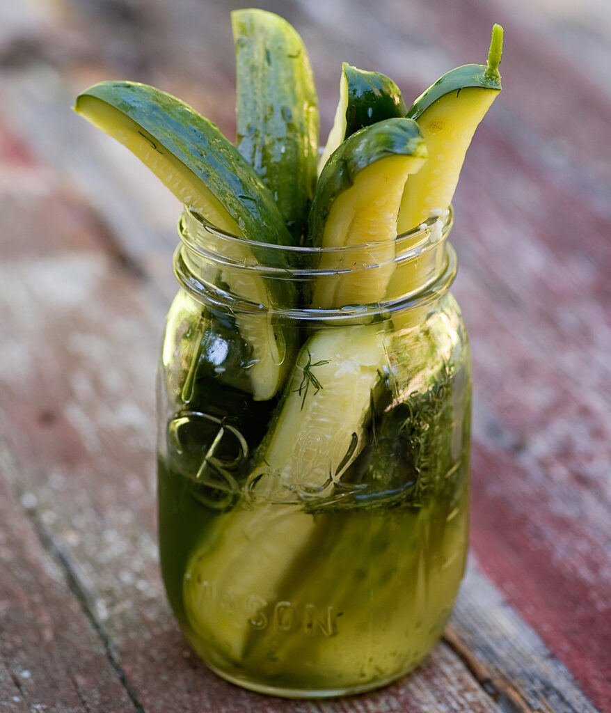 Homemade pickles in a mason jar.
