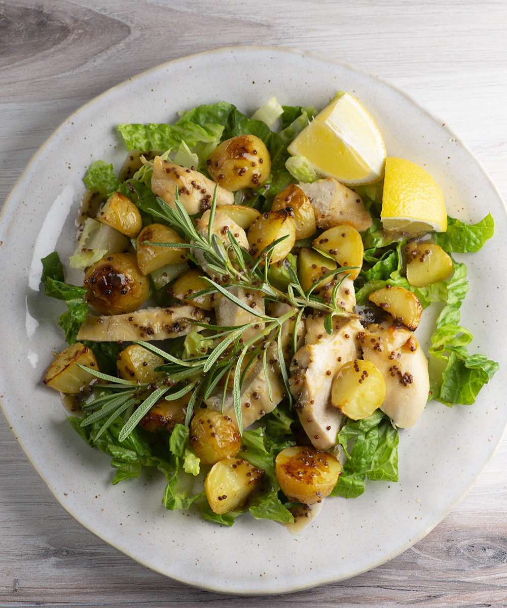Plate of roasted chicken potato salad.