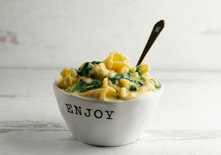 Odds and Ends Macaroni and Cheese in a bowl with a spoon.