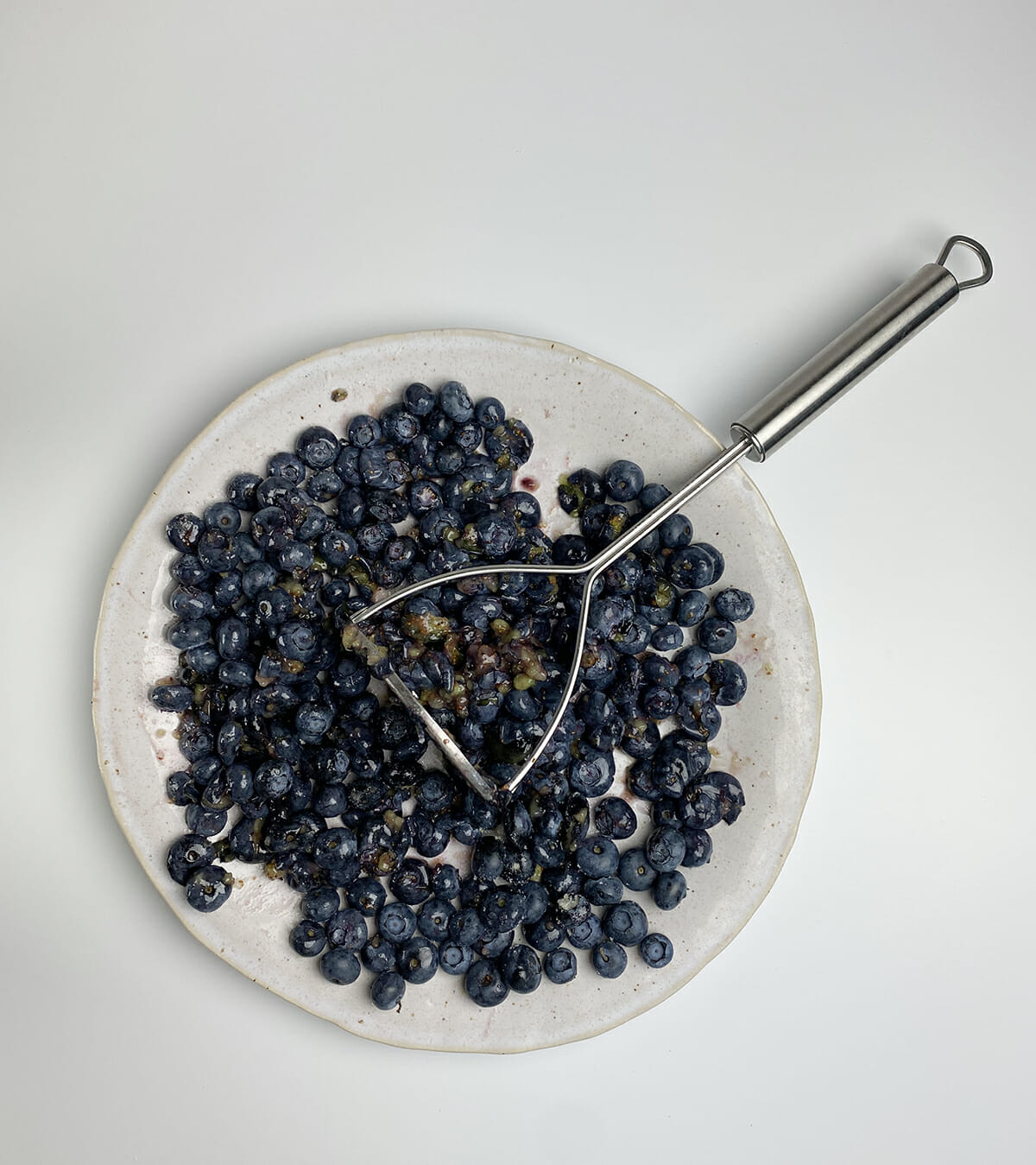 texas blueberry cobbler smashed blueberries