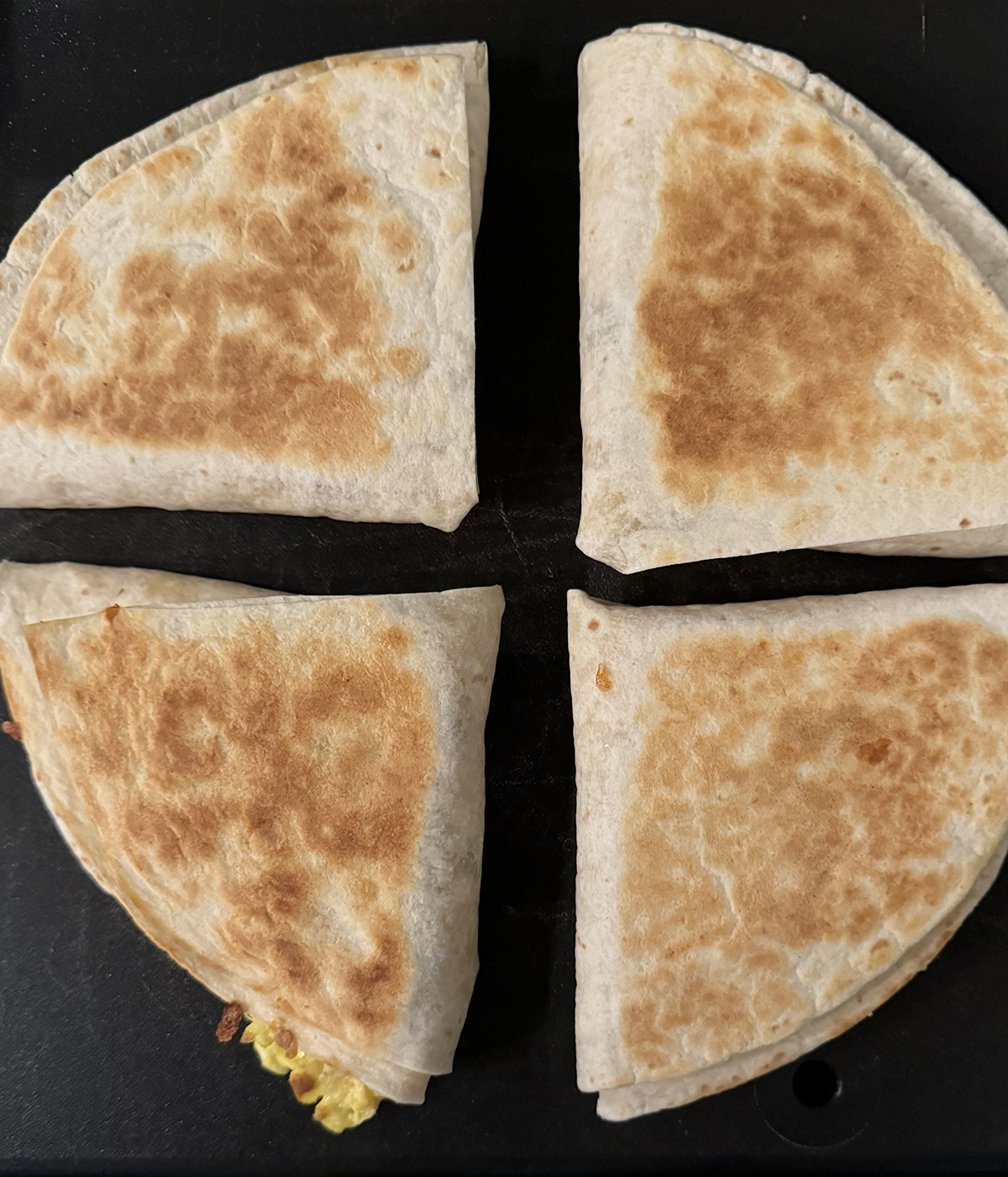 Breakfast quesadilla on the griddle.