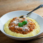 Polenta with sweet tomato sauce in a bowl.