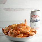 Shrimp cooked in beer in a bowl.