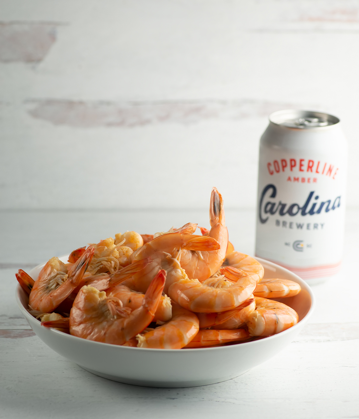 Shrimp cooked in beer in a bowl.