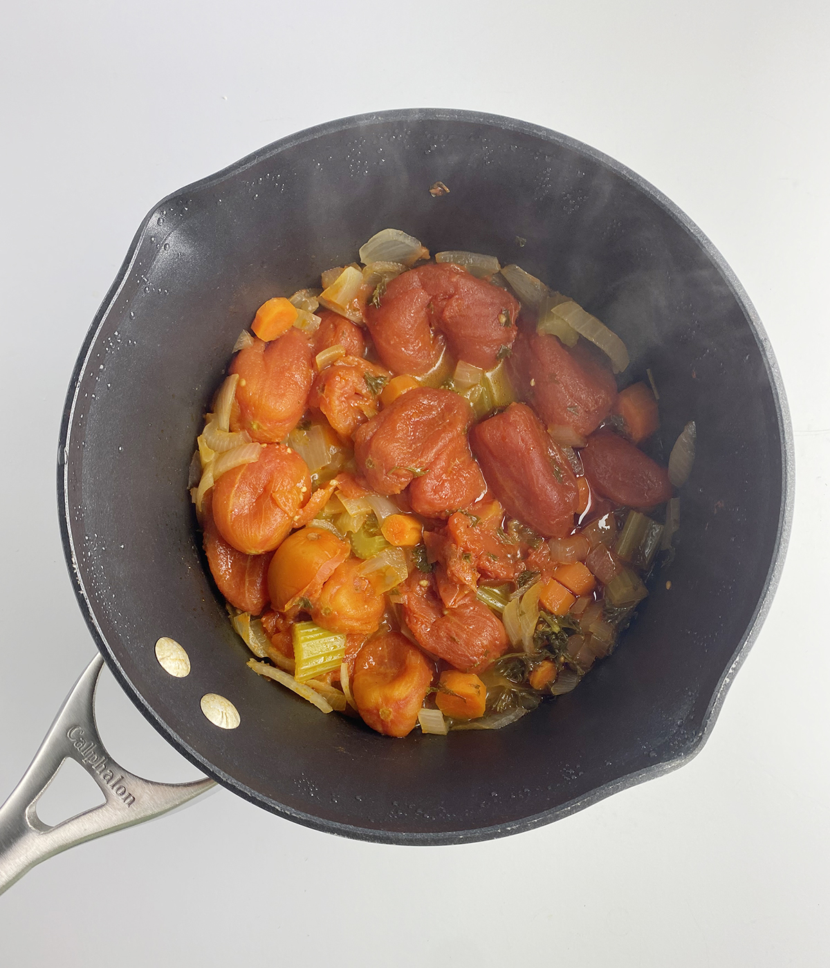 Vegetables for sweet tomatoes sauce cooked in a pot.