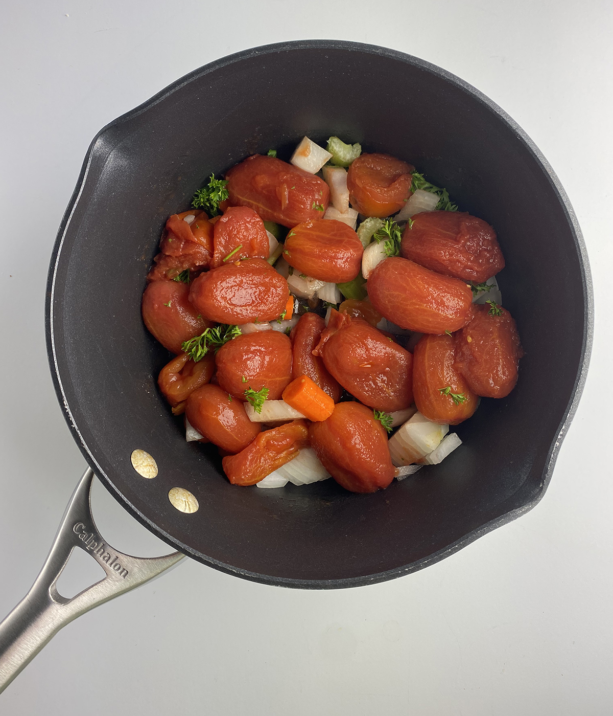 Vegetables for sweet tomato sauce in a pot ready to be cooked.