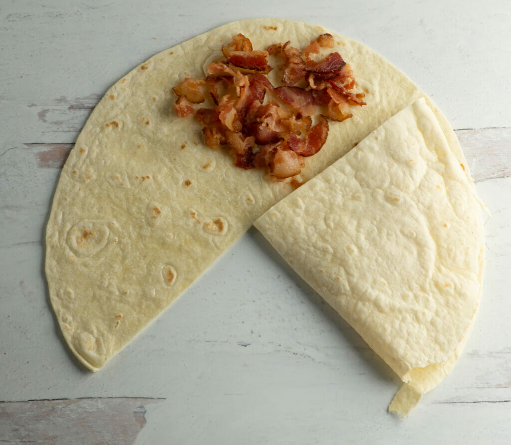 Breakfast quesadilla bacon layer.