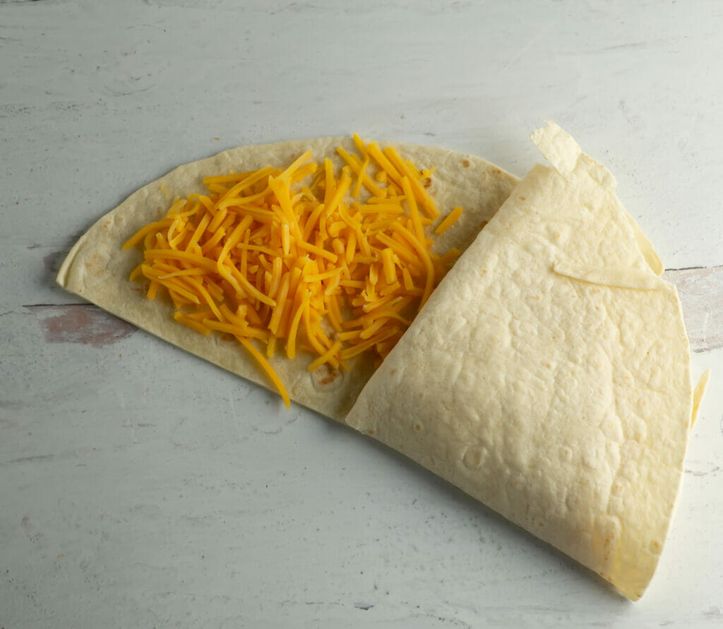 Breakfast quesadilla with cheese section.
