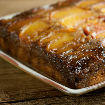 Peach upside down cake on a square platter.