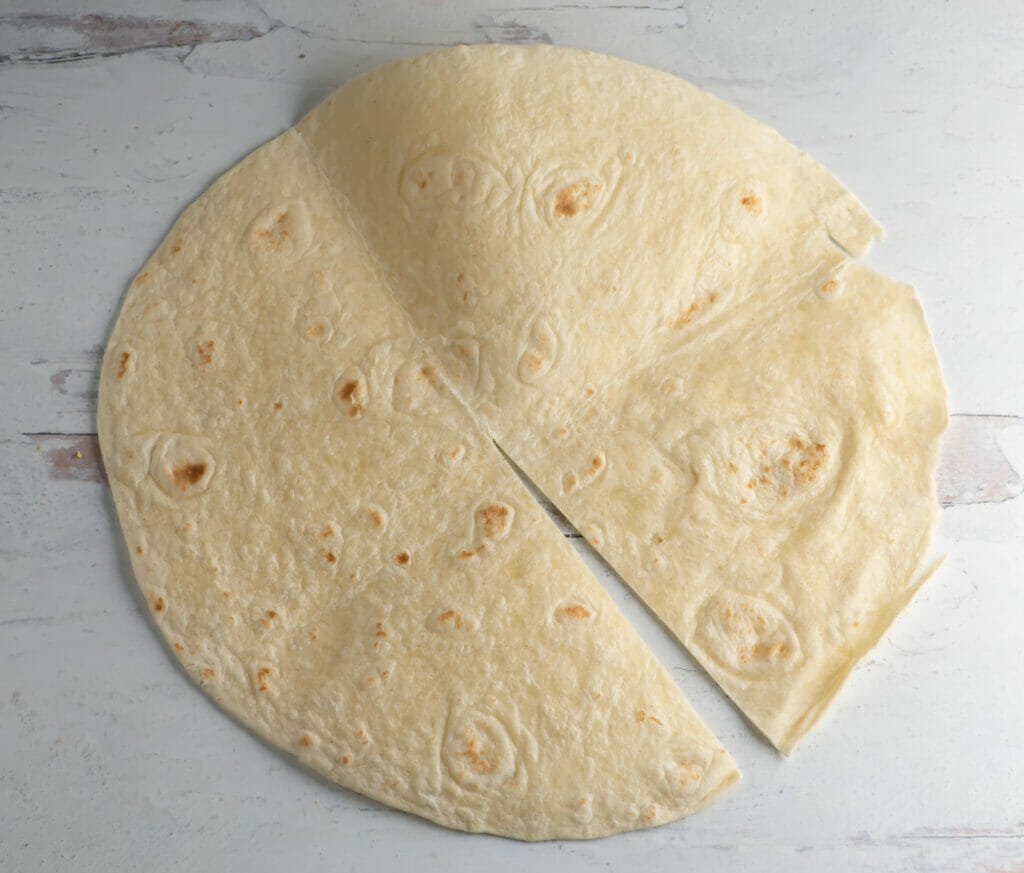 Tortilla with a partial slice in it.