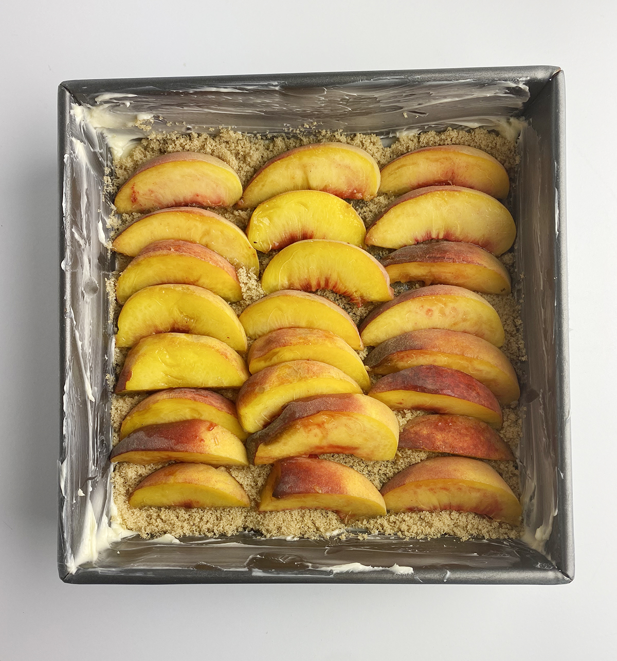 Peach slices in a pan.
