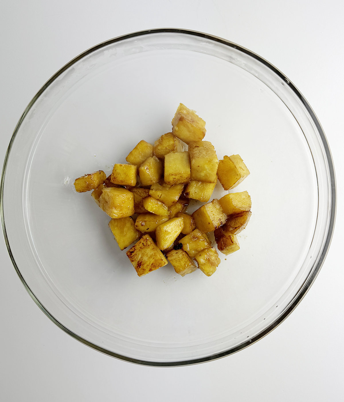 Cooked pineapple in a bowl.