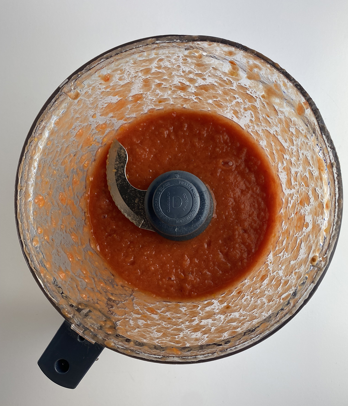 Pureed tomatoes in a food processor