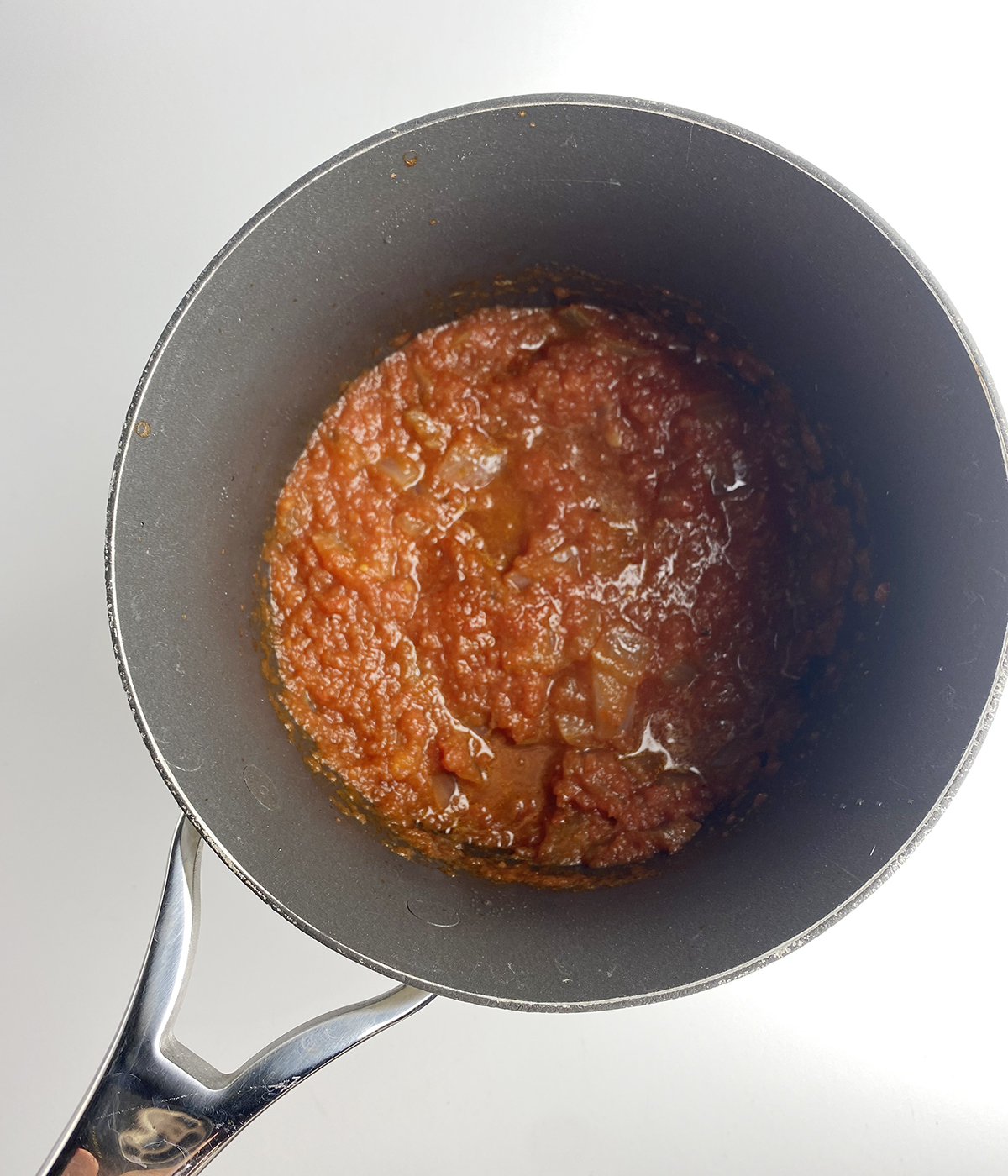 Pureed tomatoes in a pot.