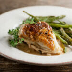 White wine chicken on a plate.