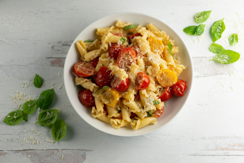 Fresh tomato basil pasta in a bowl.