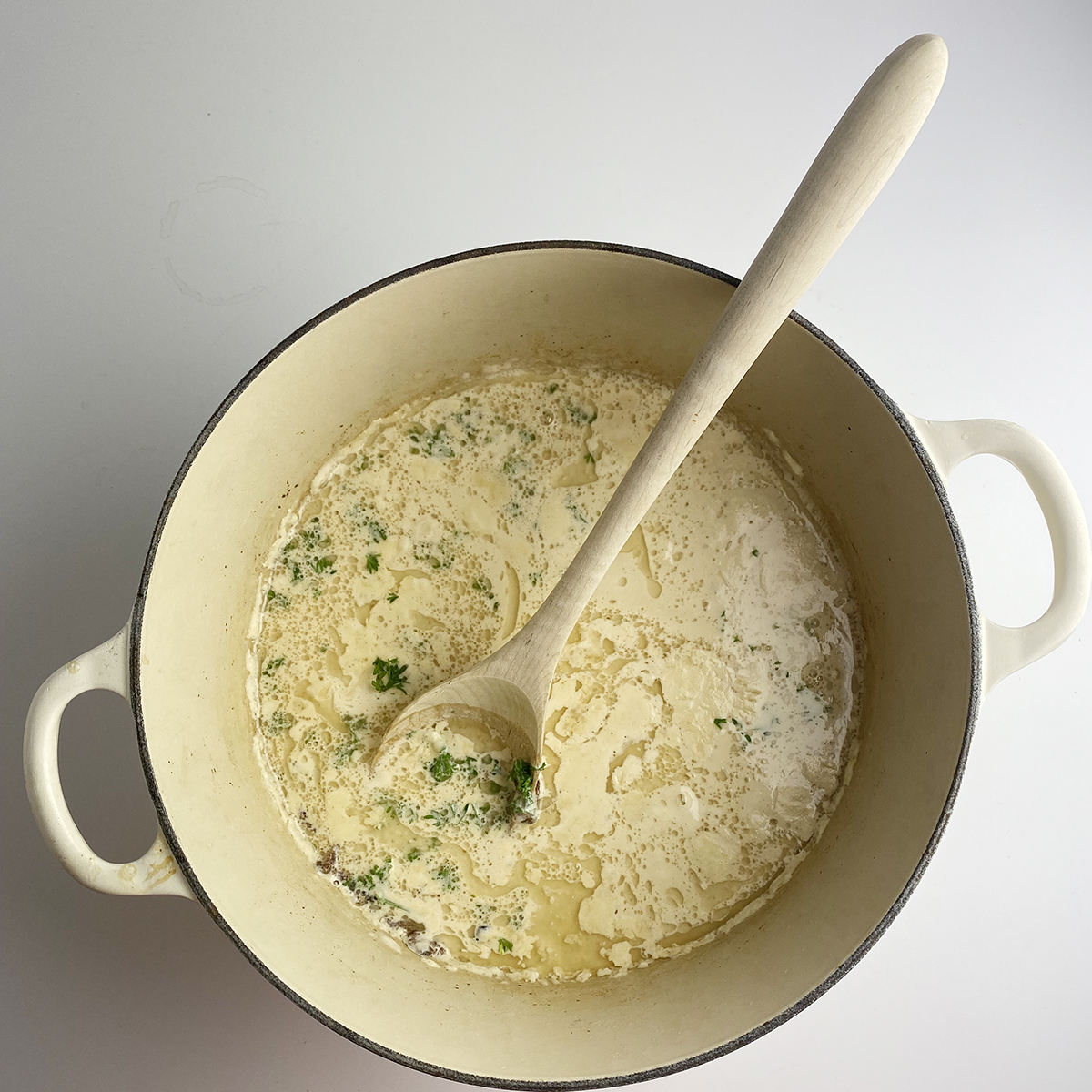 Mussels Cider sauce with cream, apple cider and brandy in a pot.