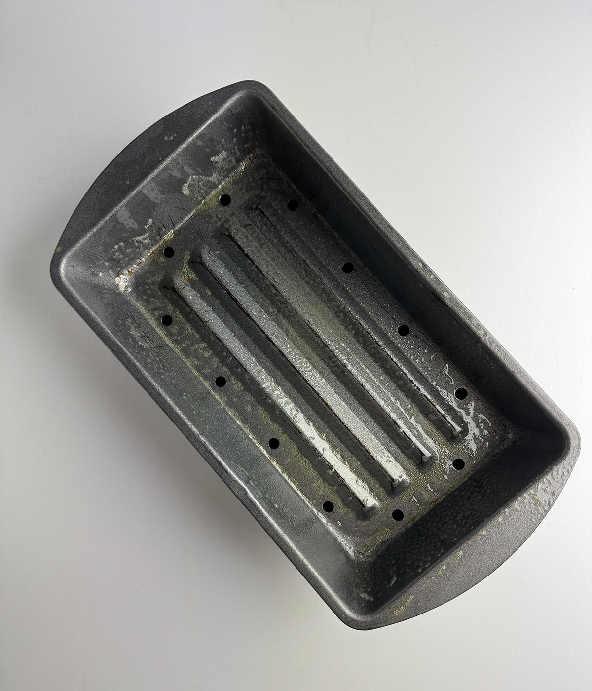 Greased meatloaf baking pan.