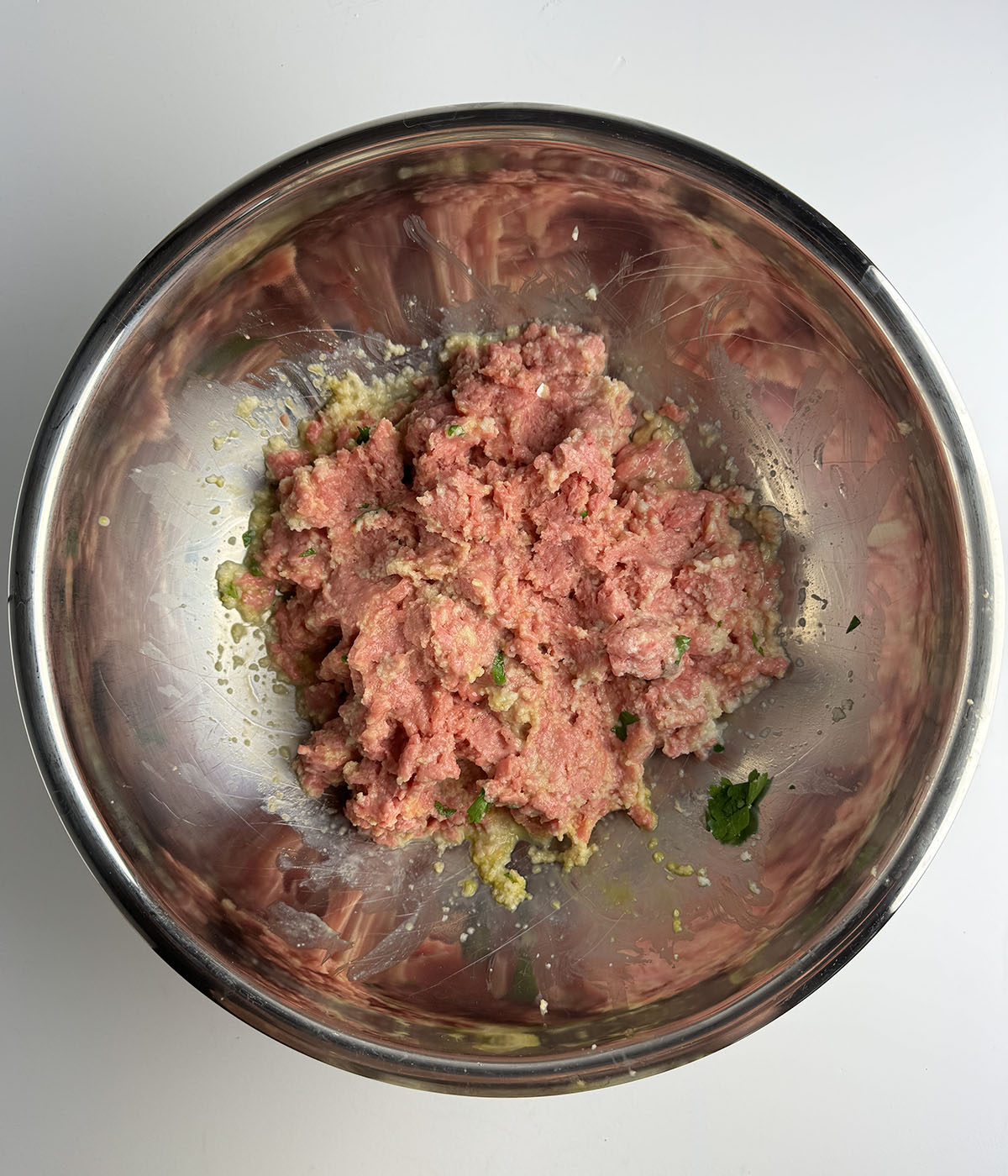 Meatloaf mixture in a mixing bowl.