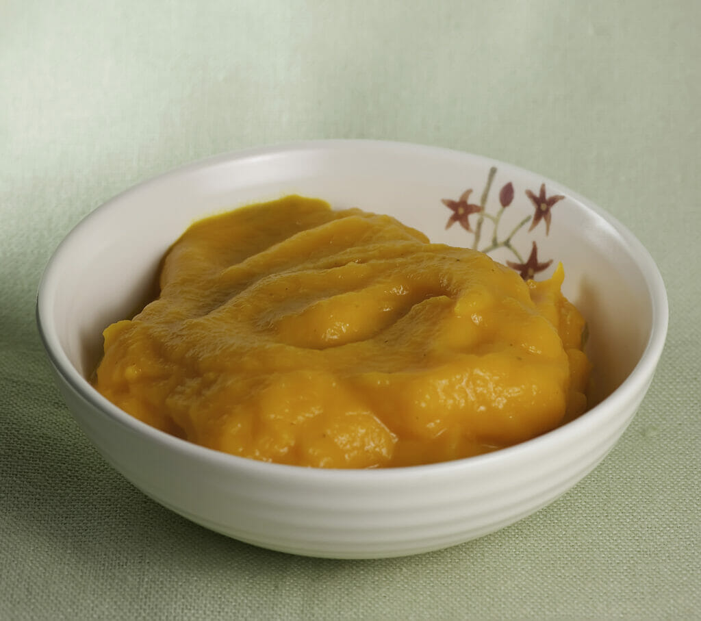 Creamy whipped carrots in a bowl.