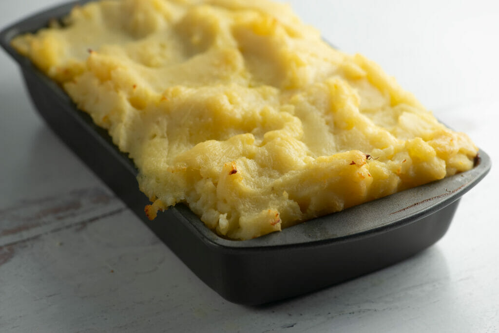 frosted meatloaf in pan