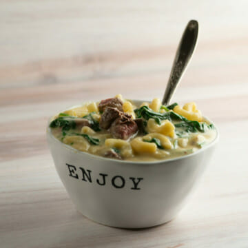 Steakhouse macaroni and cheese in a bowl with a fork.