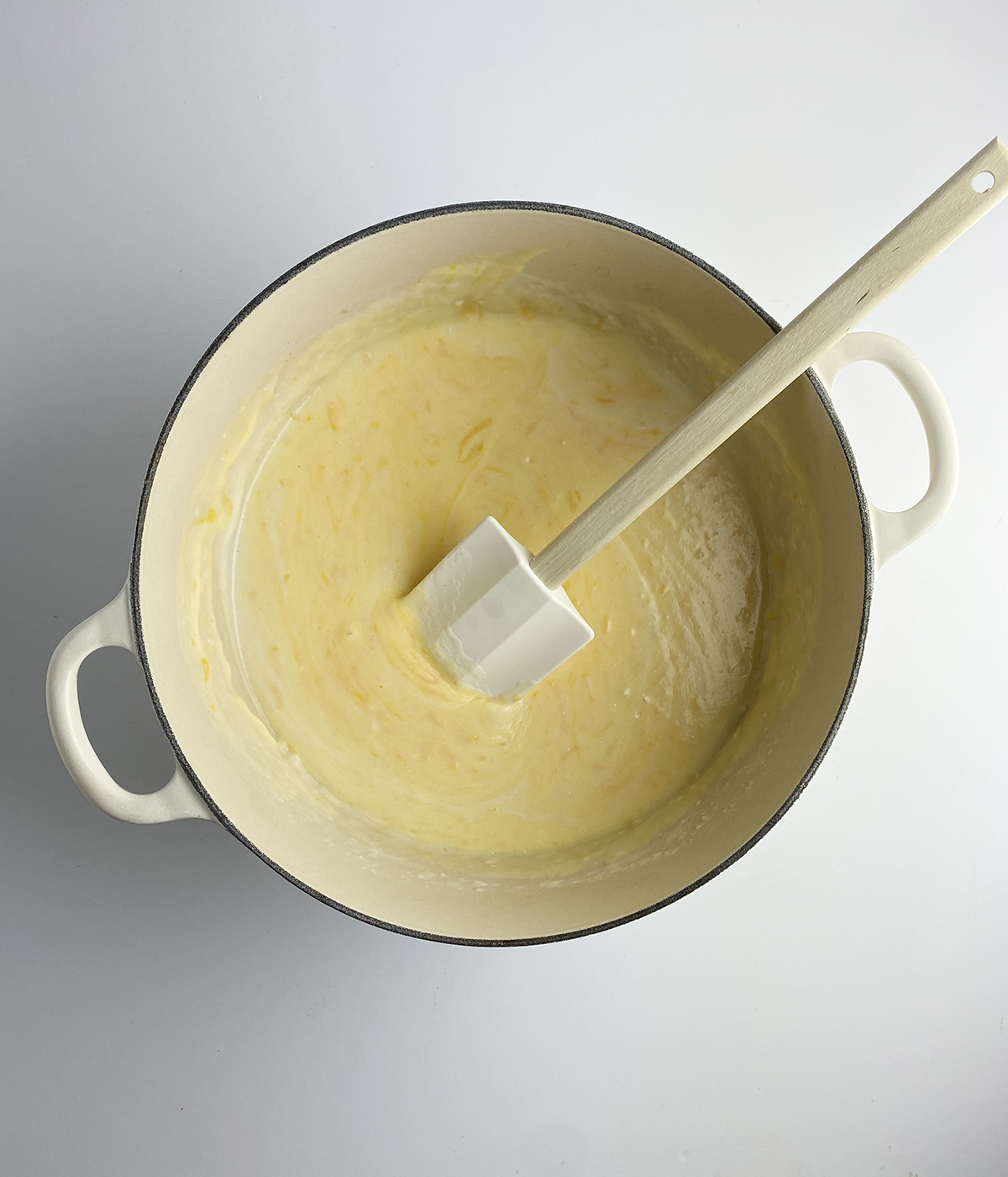 Cheese sauce in a Dutch oven.