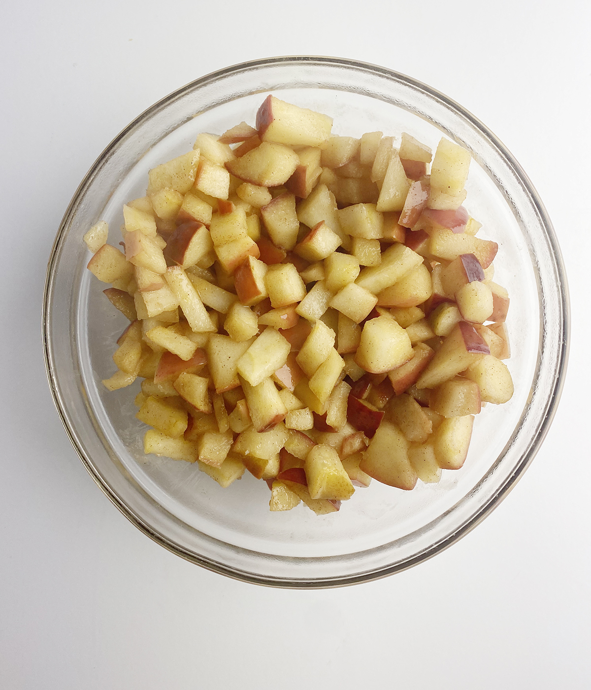 Chopped and cooked apples in a mixing bowl.