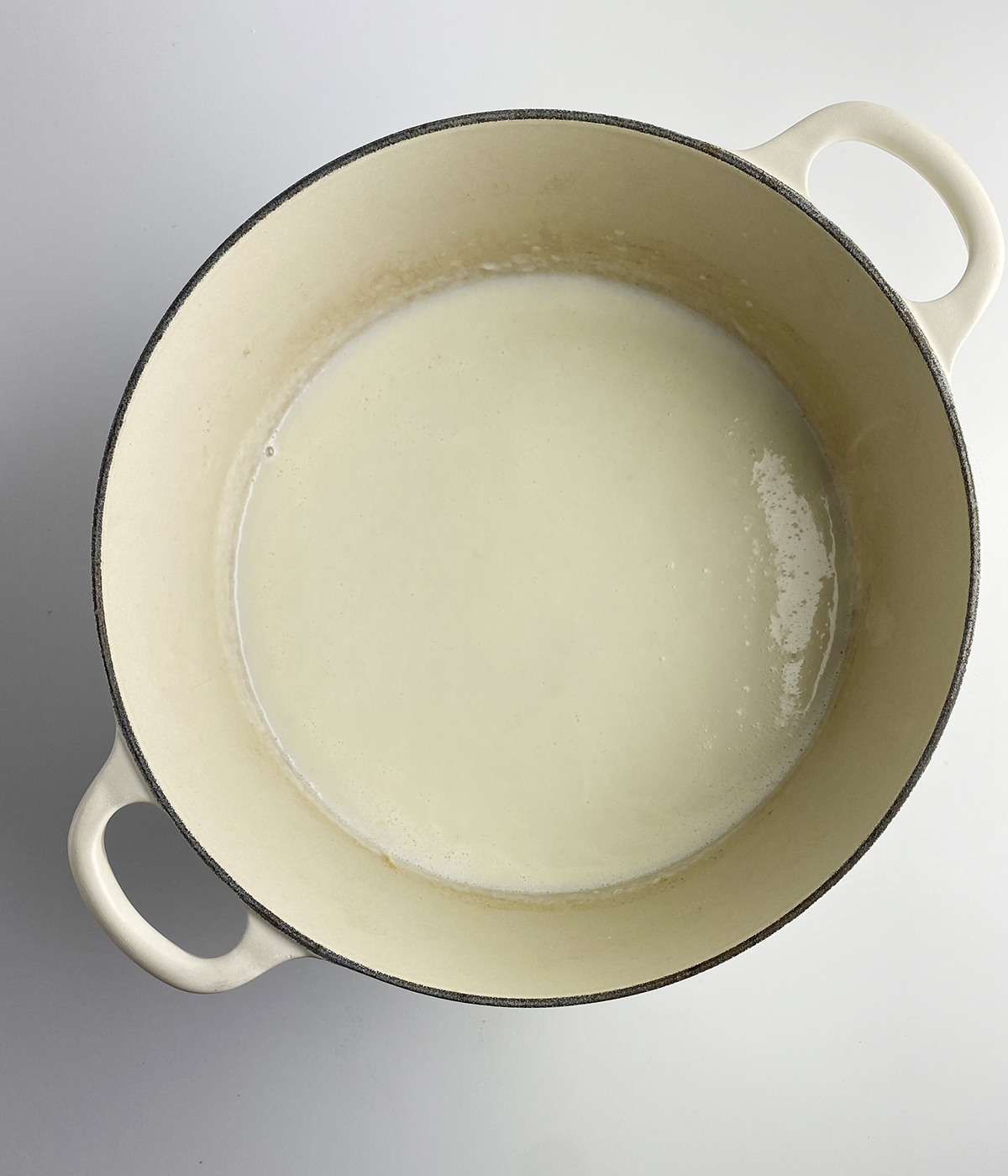 Flour milk and butter sauce in a Dutch Oven.