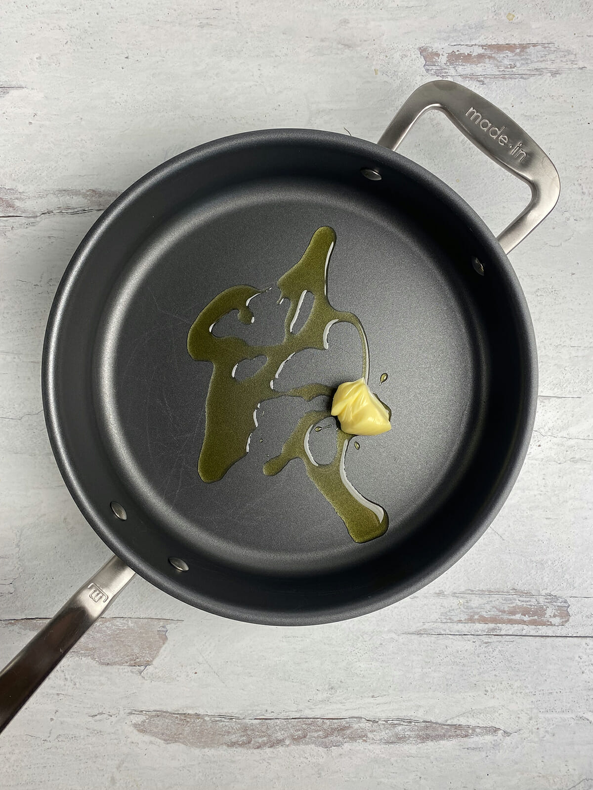 Butter and oil melting in a pan.