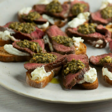 Filet Mignon Pesto Crostini on a plate.