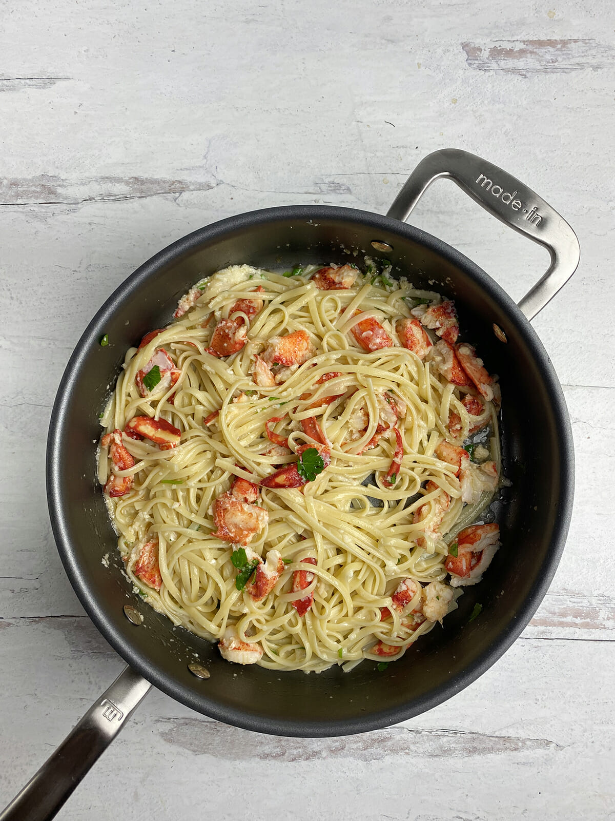 Lobster lemon pasta in a skillet.