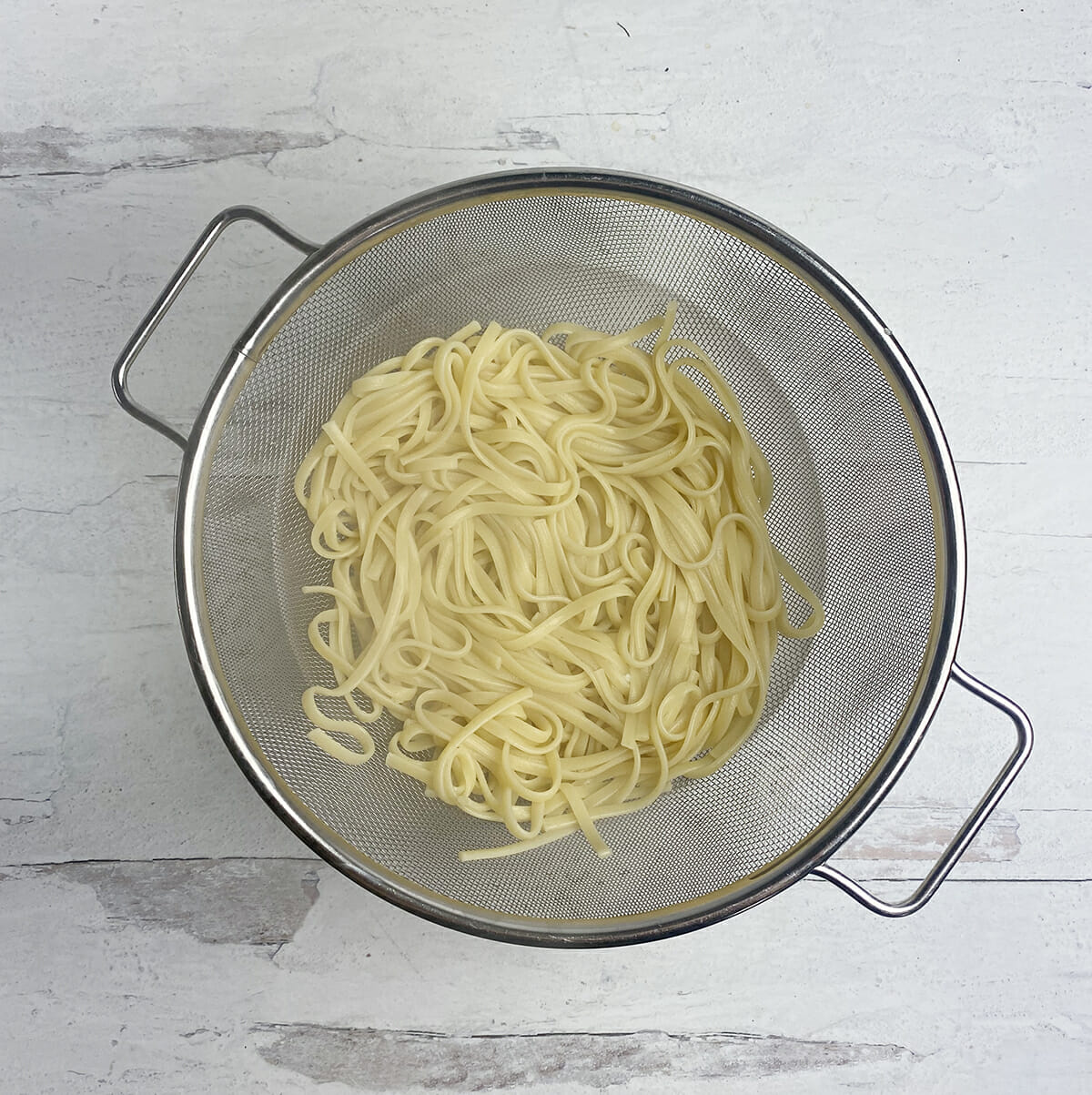 Pasta draining in a strainer