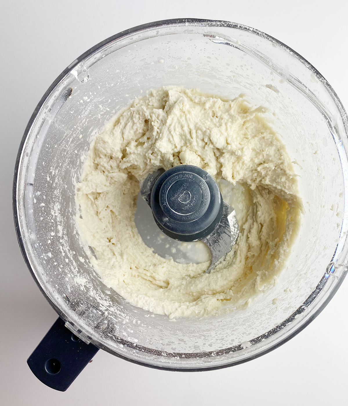 Dumpling dough in a food processor.