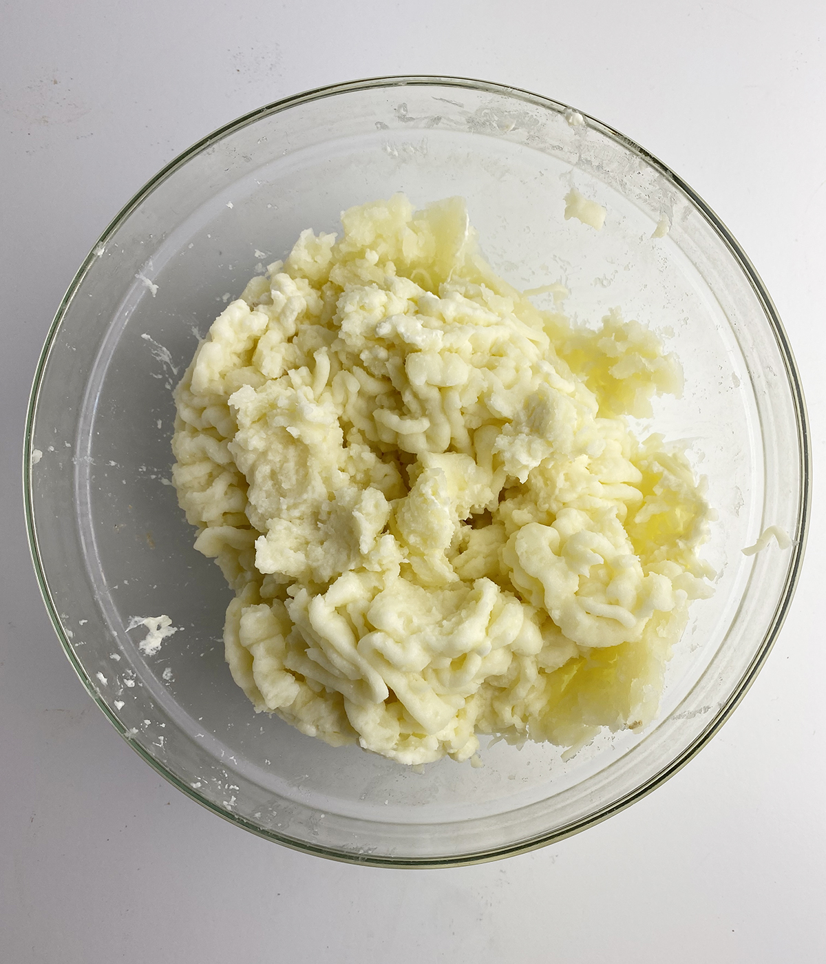 Mashed potatoes in a mixing bowl.