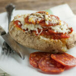 Pizza Twice Baked Potatoes with a fork.