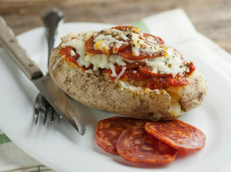 Pizza Twice Baked Potatoes with a fork.