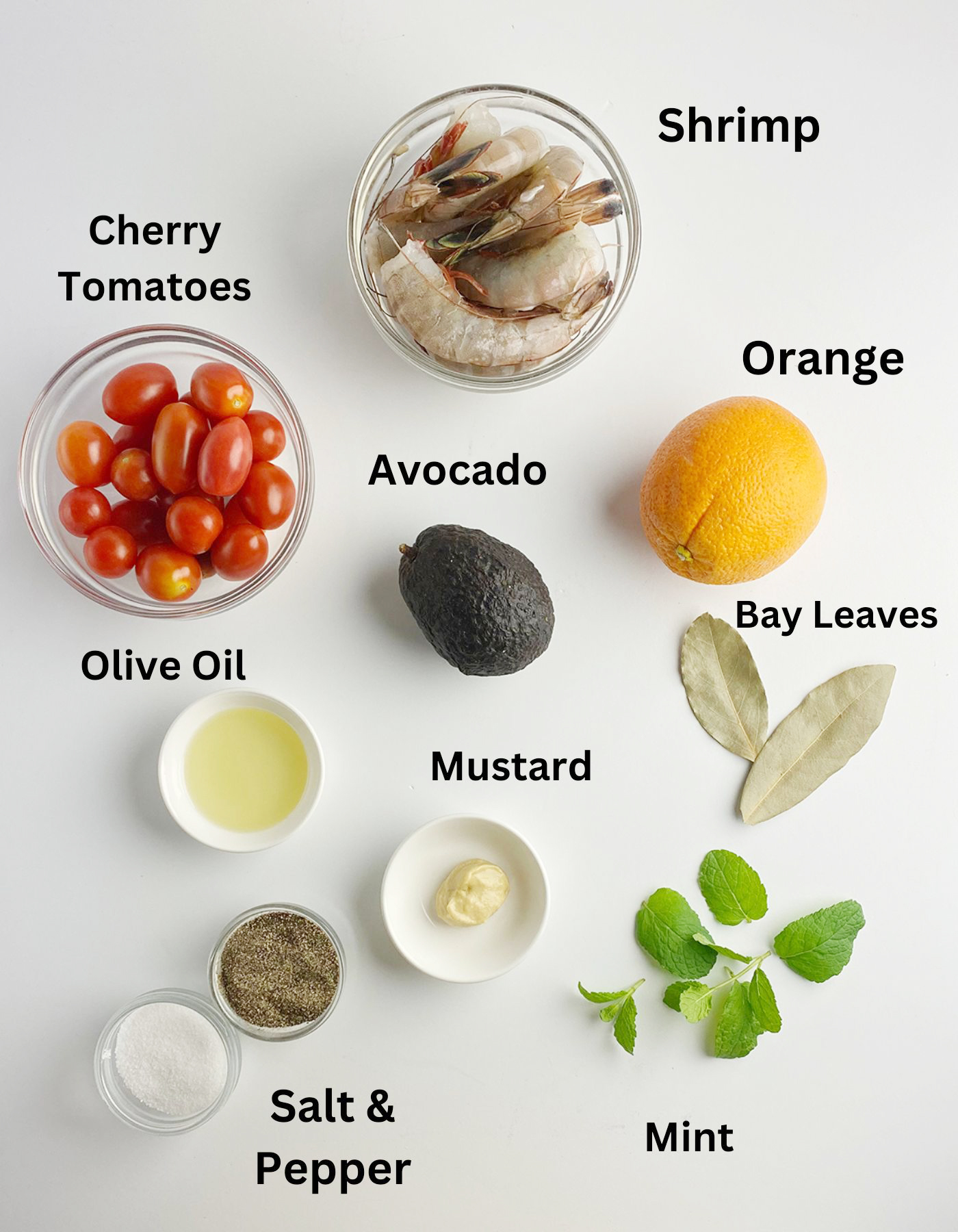 Ingredients needed for an Orange Avocaco Shrimp Salad.