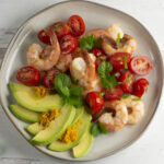 Orange Avocado Mint Shrimp Salad on a plate.