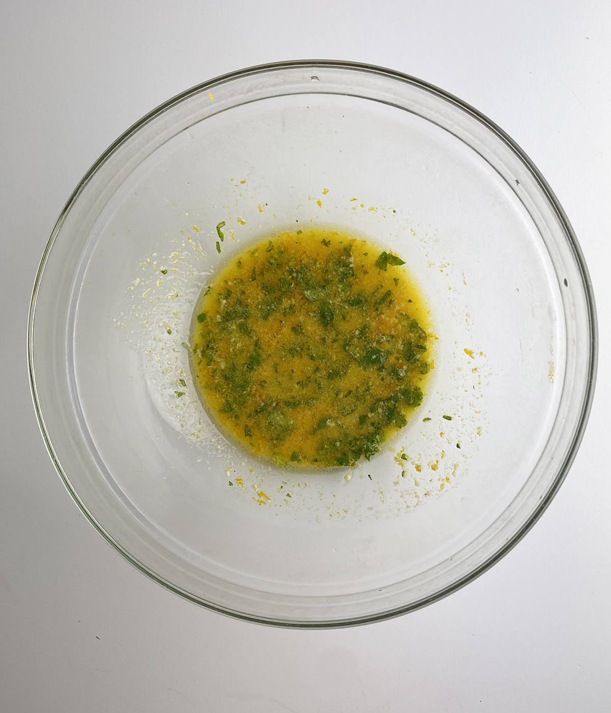 Orange mint dressing in a mixing bowl.