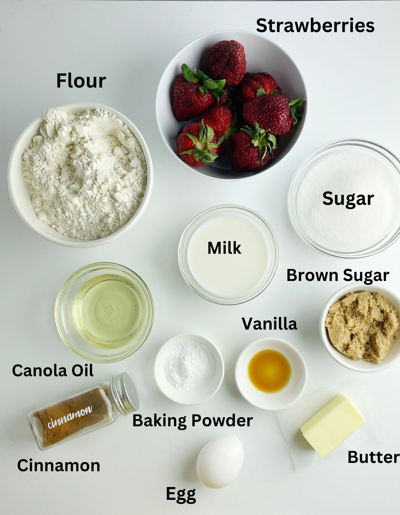 Ingredients needed for strawberry crumble muffins.